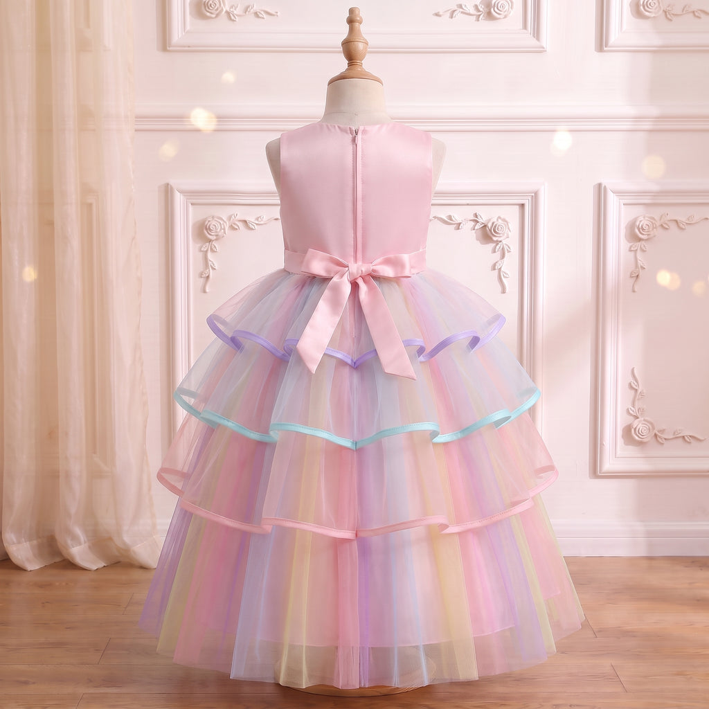 Back view of the pink unicorn gown on a mannequin: center back zipper and satin bow, dress only