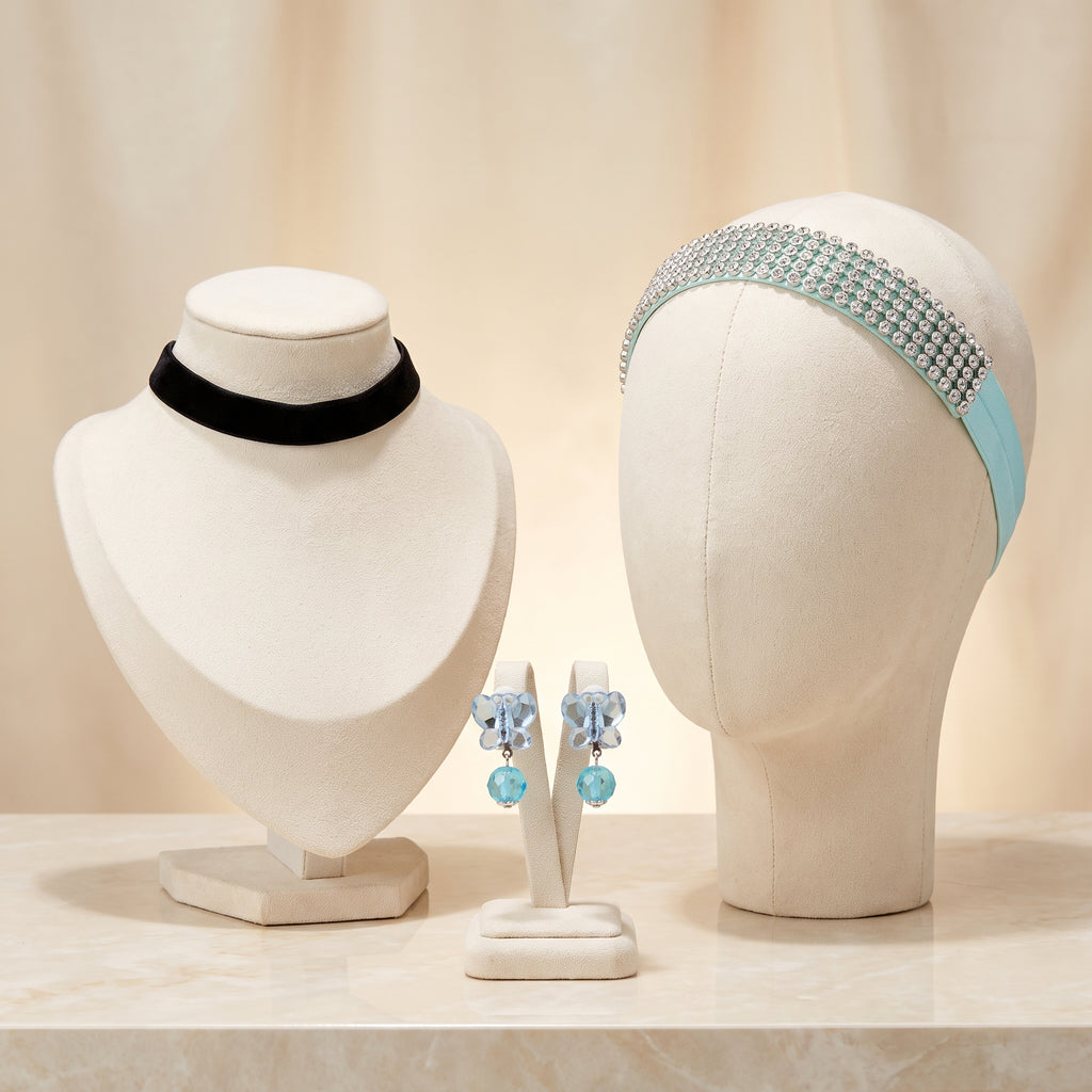 Cinderella Accessory Set flat lay: black ribbon choker, light blue rhinestone headband and blue butterfly clip-on earrings