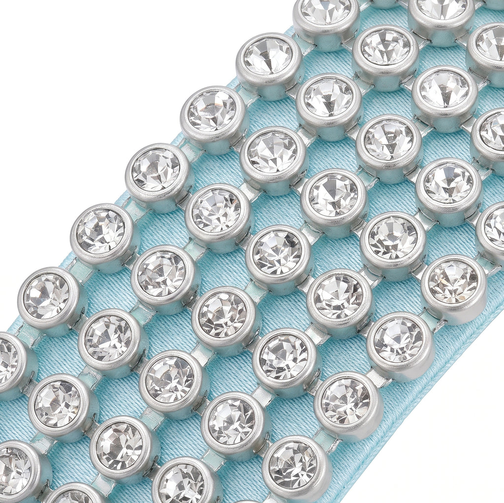 Close up of the rows of clear rhinestones on the light blue headband