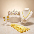 Golden Accessory Set flat lay: rhinestone tiara, yellow bead crown-pendant necklace, yellow heart clip-on earrings and yellow satin gloves
