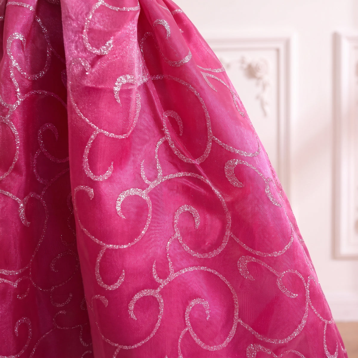 Close up of the pink organza skirt with its silver swirl shimmer print