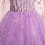 Close up of the pointed waist where the lavender glitter tulle skirt gathers on the Rapunzel gown