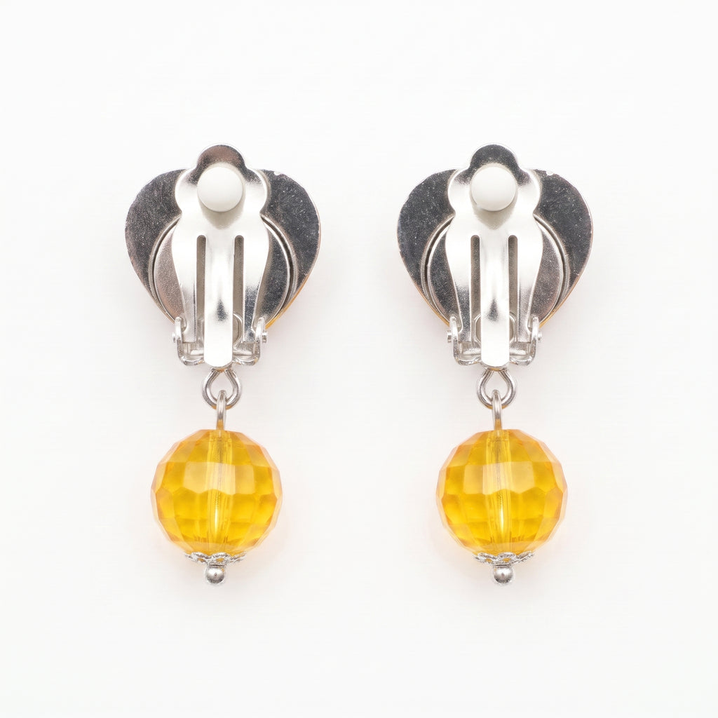Clip-on backs on the yellow heart earrings, no pierced ears needed