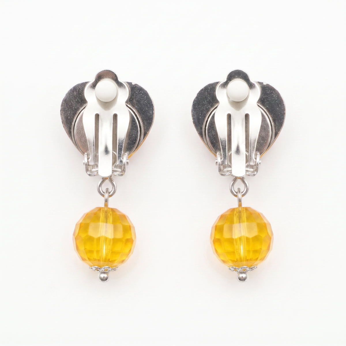 Clip-on backs on the yellow heart earrings, no pierced ears needed