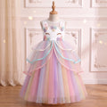 Front view of the White Rainbow Unicorn Ribbon Gown on a mannequin: unicorn-face bodice, ribbon-edged ruffles, rainbow tulle skirt