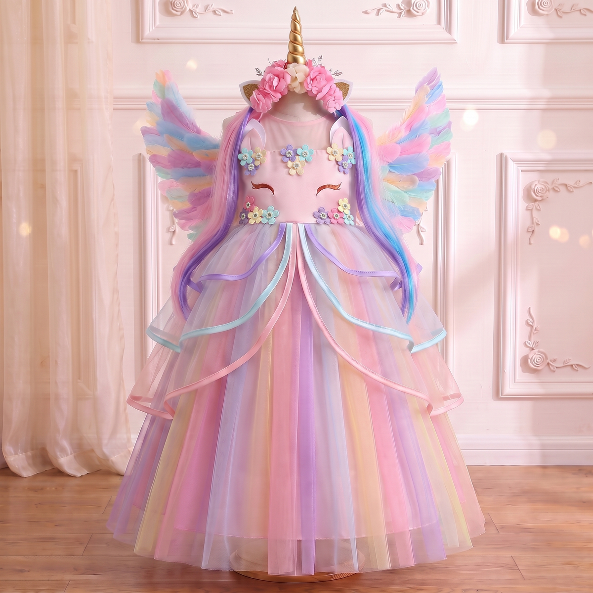Front view of the Pink Rainbow Unicorn Ribbon Gown on a mannequin with the horn headband and wings