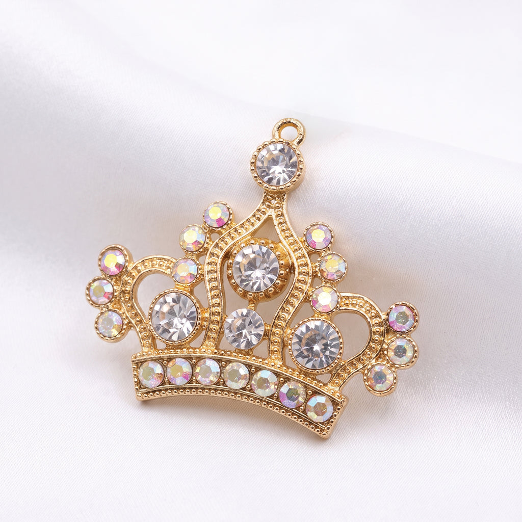 Gold crown pendant set with clear and iridescent rhinestones
