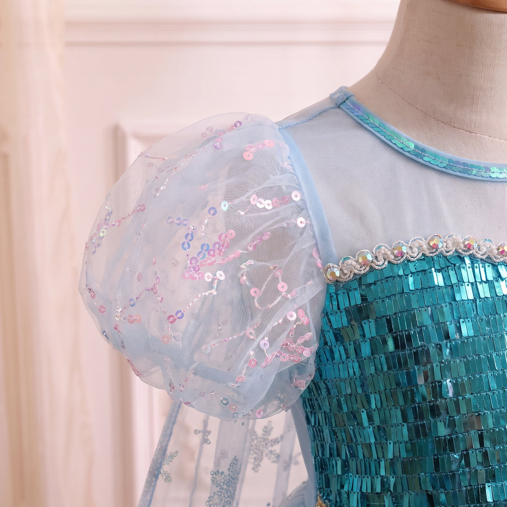 Close up of a sheer ice blue puff sleeve flecked with pink and silver sequins