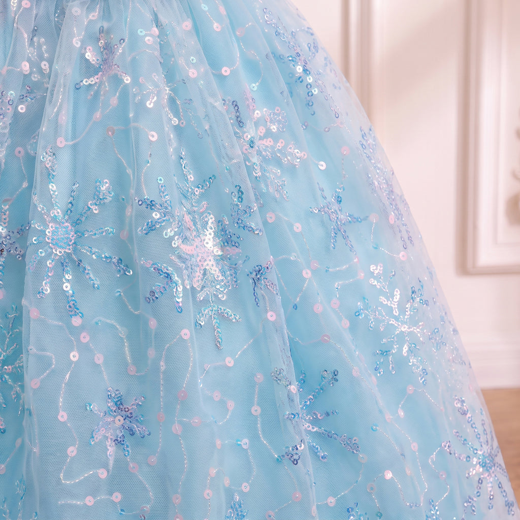 Close up of the sequin snowflake embroidery on the ice blue skirt