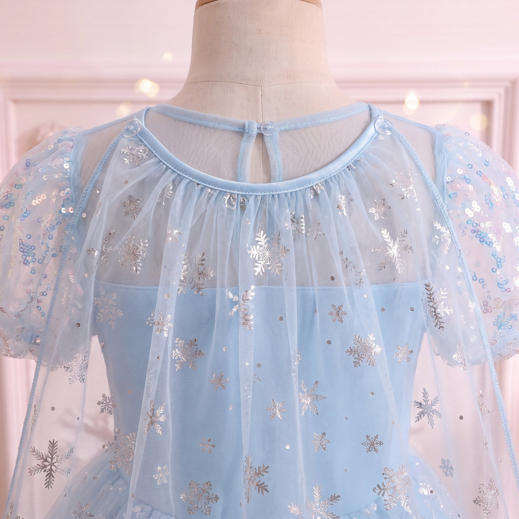 Back view of the sheer yoke and shoulders where the snowflake cape attaches