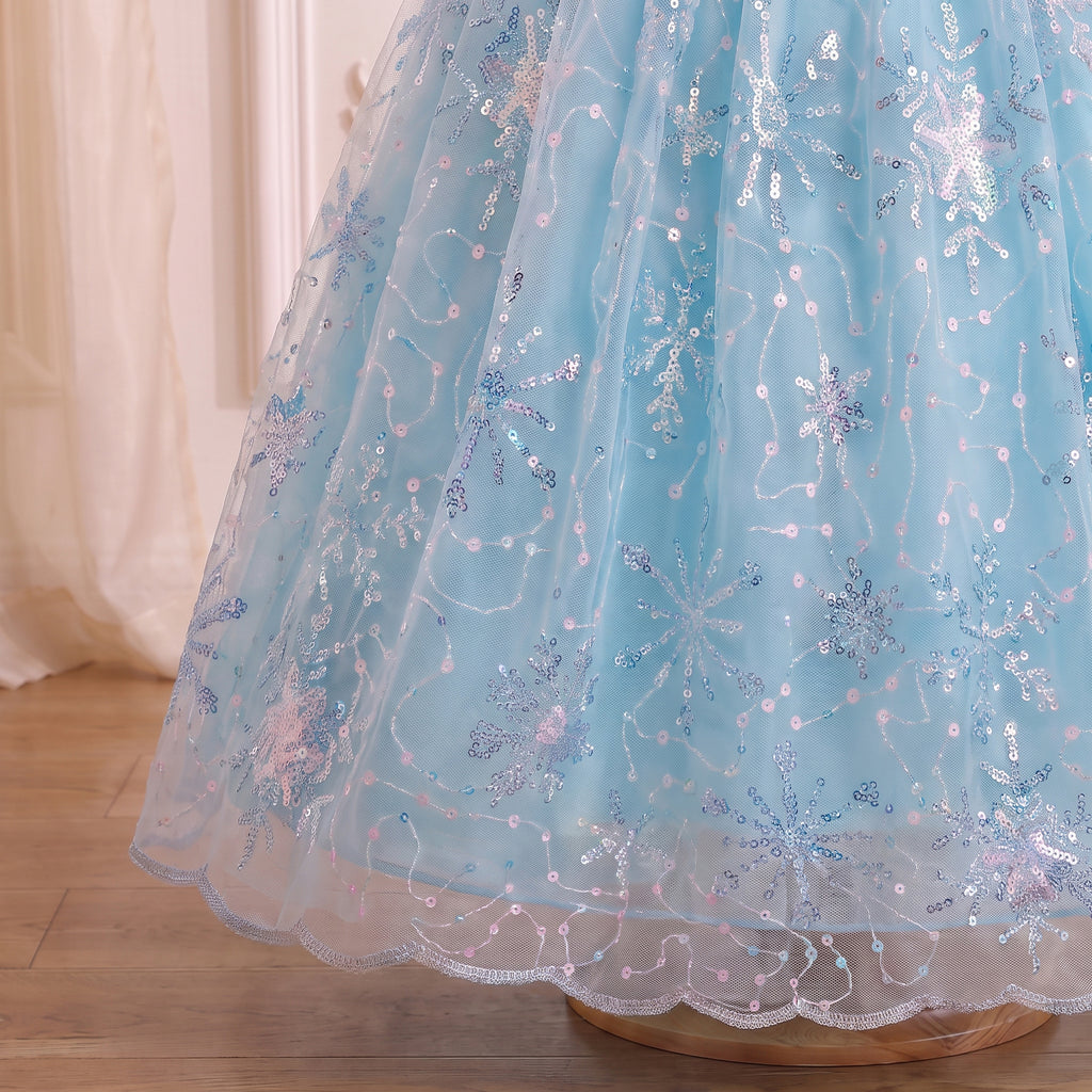 Close up of the ice blue tulle skirt embroidered with iridescent sequin snowflakes
