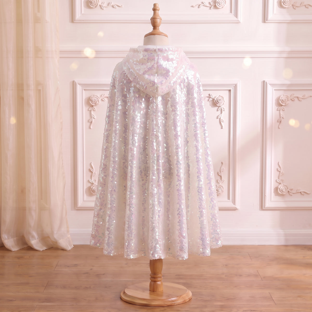 Back view of the Ice Queen Frostlight Cape on a mannequin, hood down