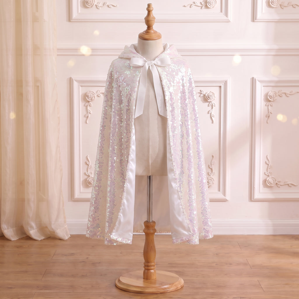 Front view of the Ice Queen Frostlight Cape on a mannequin: iridescent sequins and white ribbon ties
