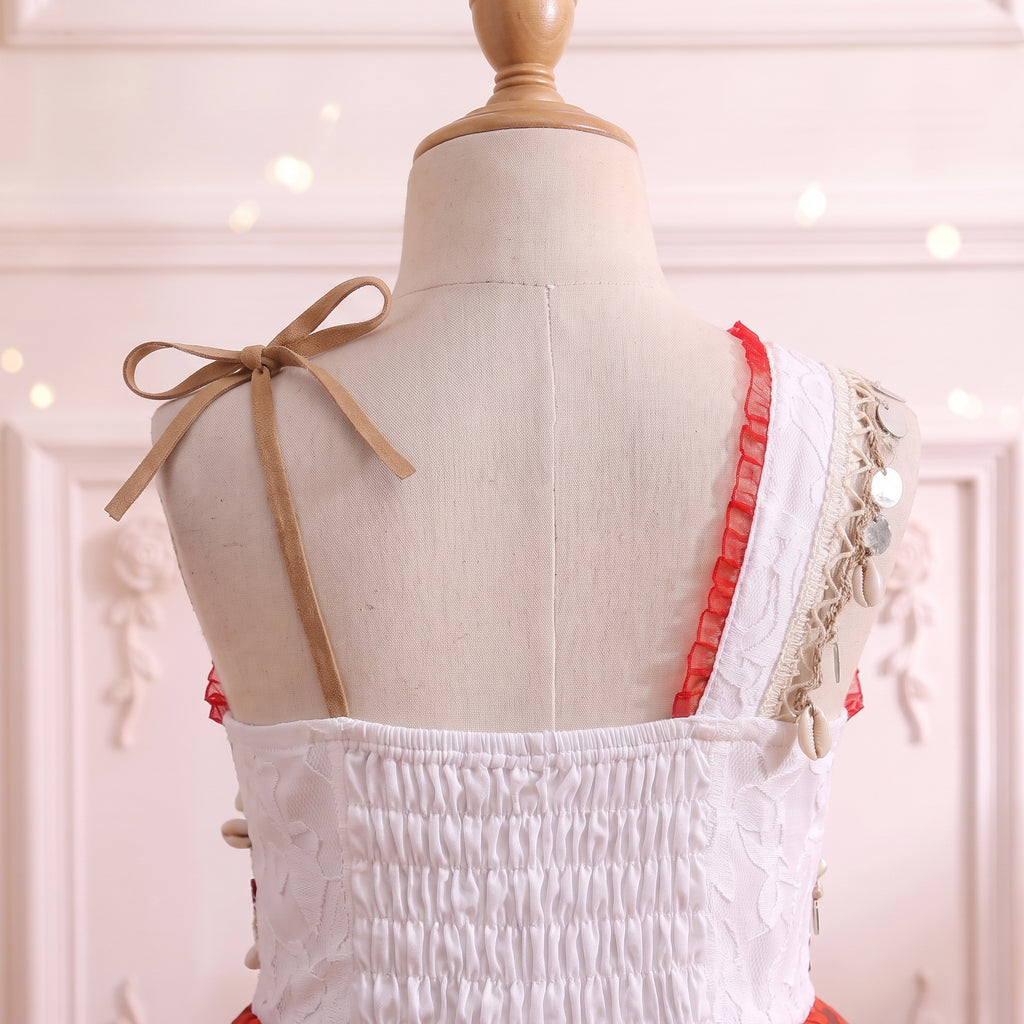 Close up of the suede ribbon shoulder bow and smocked stretch back panel