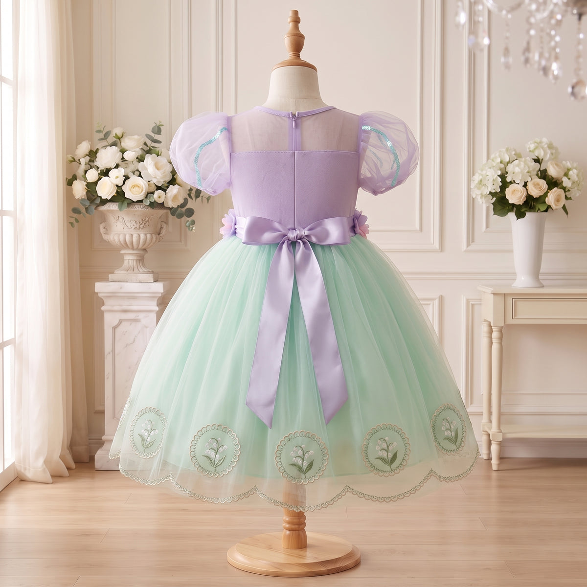 Back display of Lavender Mint Lily Dress with zipper and lavender bow