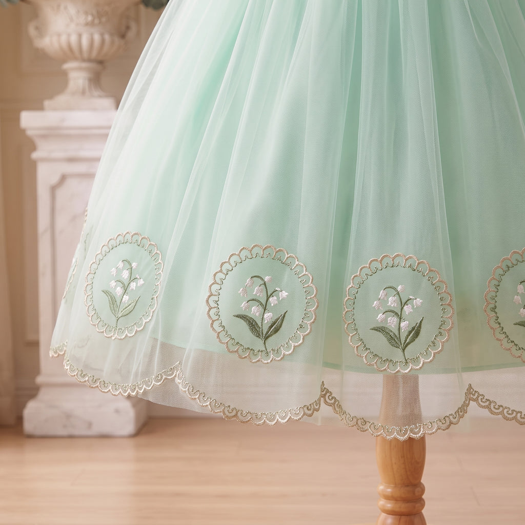 Lily-of-the-valley embroidery and scalloped skirt hem