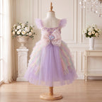 Back view of Pastel Mermaid Princess Gown with an oversized blush seashell bow