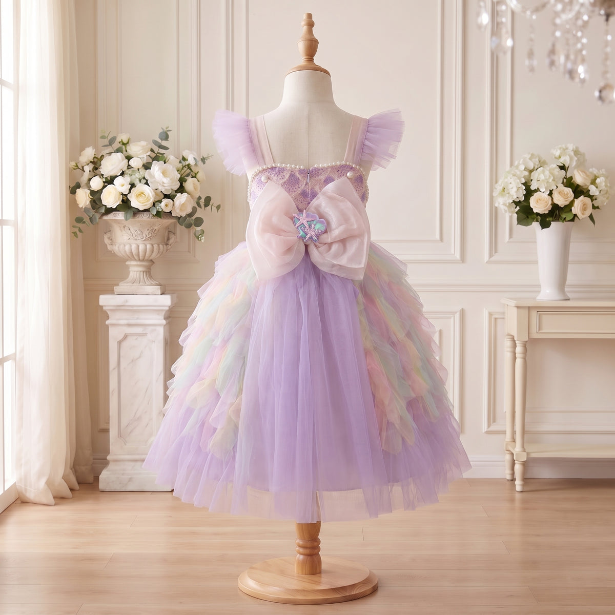 Back view of Pastel Mermaid Princess Gown with an oversized blush seashell bow